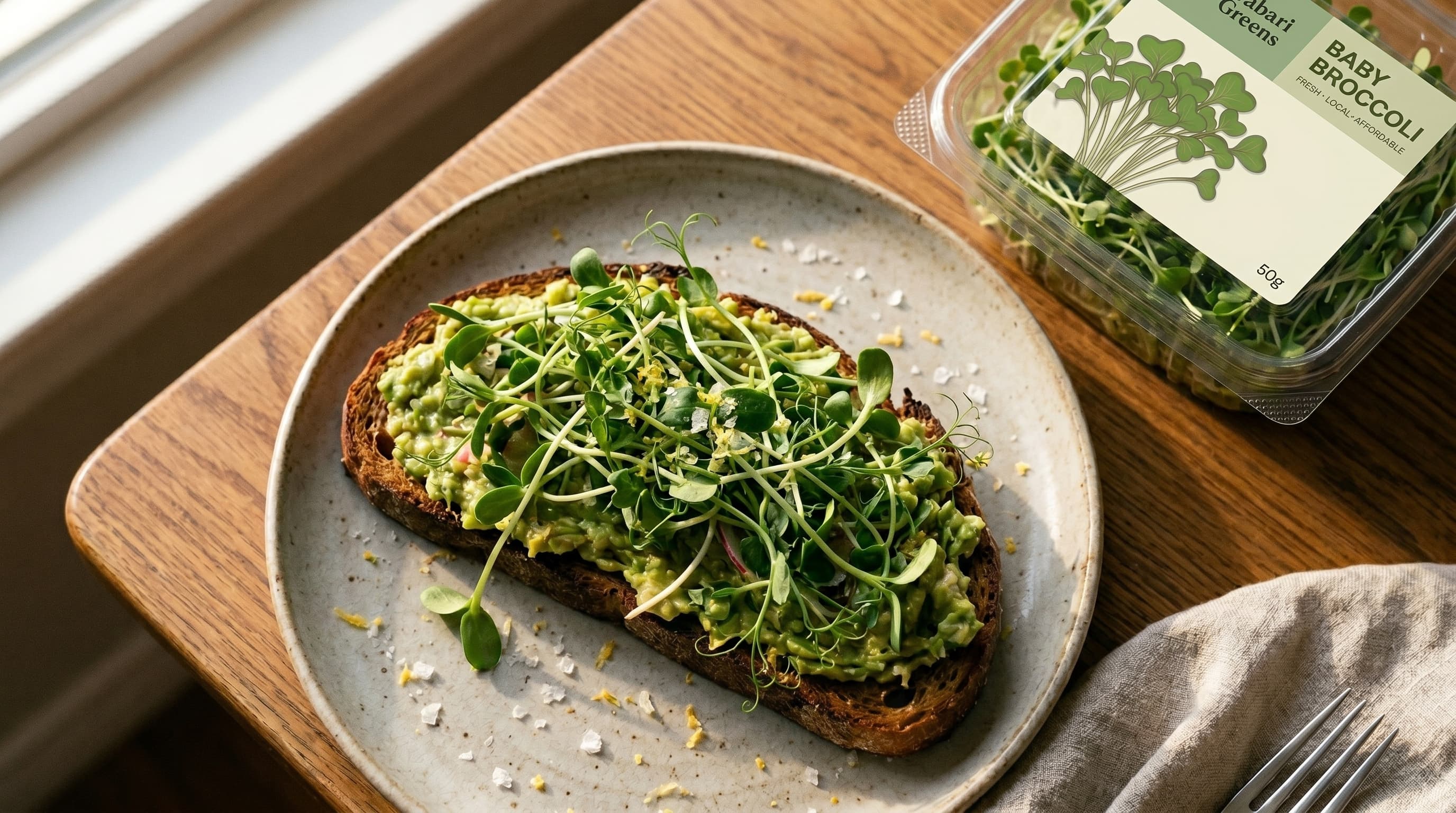 Avocado toast topped with fresh Gabari Greens baby broccoli microgreens — the end result of seed to doorstep